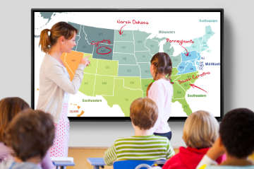 Teacher at Sharp 4T-B70CT1U AQUOS BOARD interactive display showing student where states are located on a map