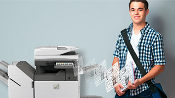 Student standing next to copier