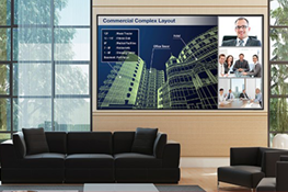 Large display on a wall in a room with couches